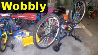 How To Straighten A Wobbly Bicycle WheelTutorial [upl. by Adlaremse]