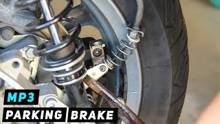 Piaggio MP3  Parking Brake Cable Installation by Wheel  Mitchs Scooter Stuff [upl. by Dougherty439]